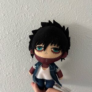 Plush Stuffed Toy with Black and Blue Outfit